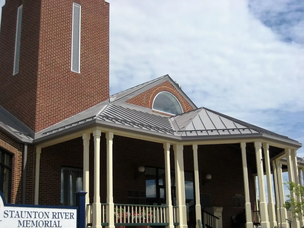 Skilled roofing craftsmen working on a residential roof in Dayton's Bluff